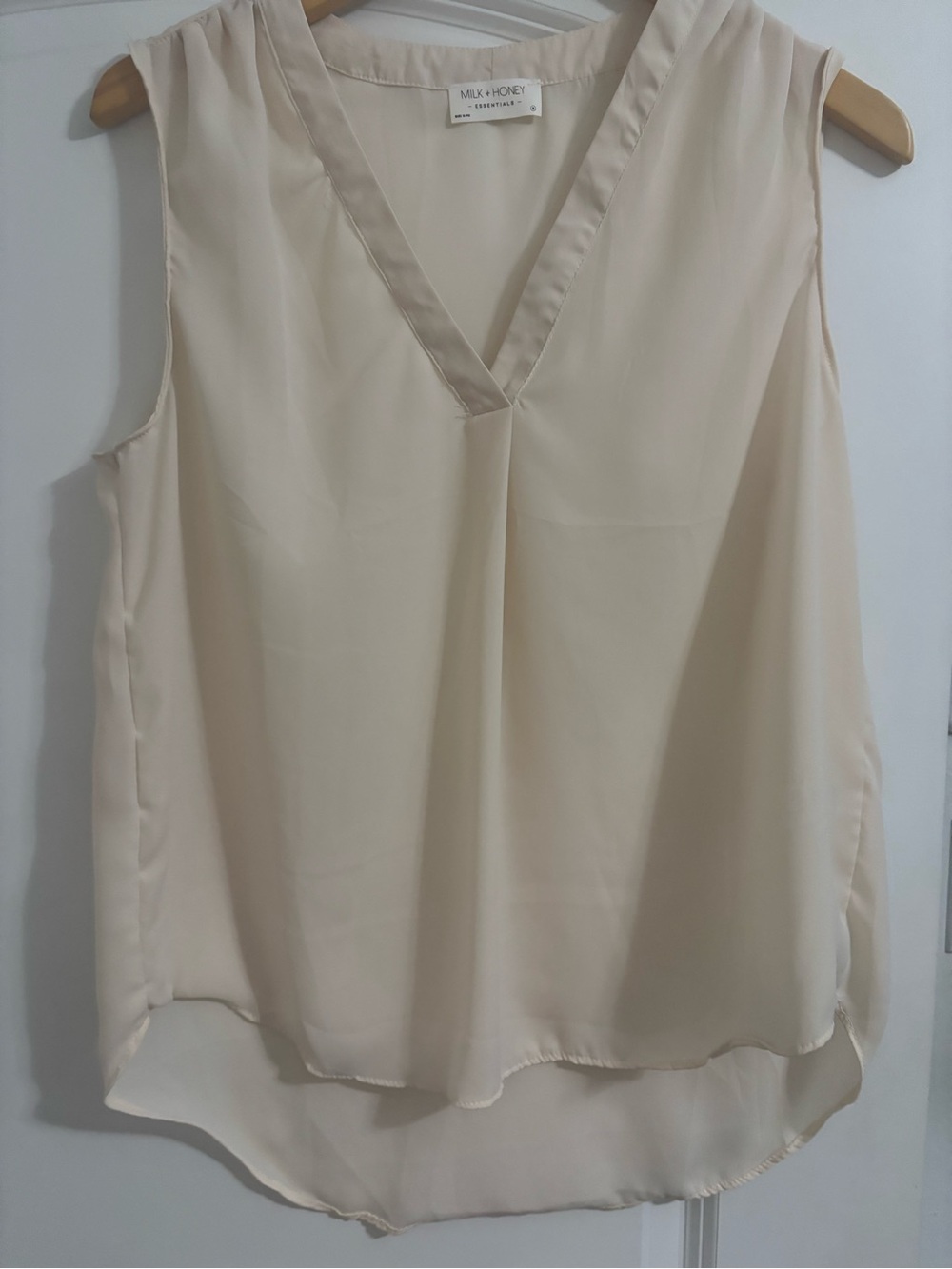 Sleeveless V-Neck Cream Blouse